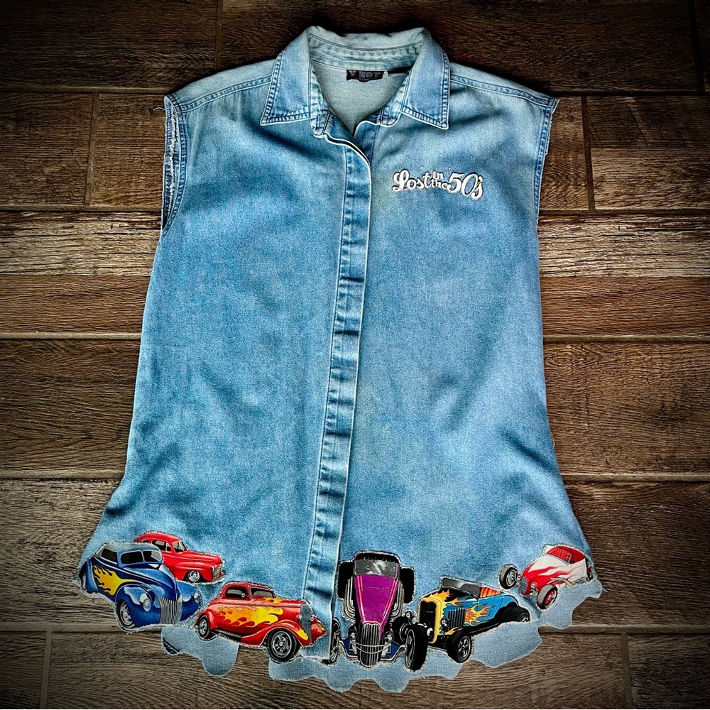 Light blue sleeveless button up shirt Lost in 50’s hot rod cars L